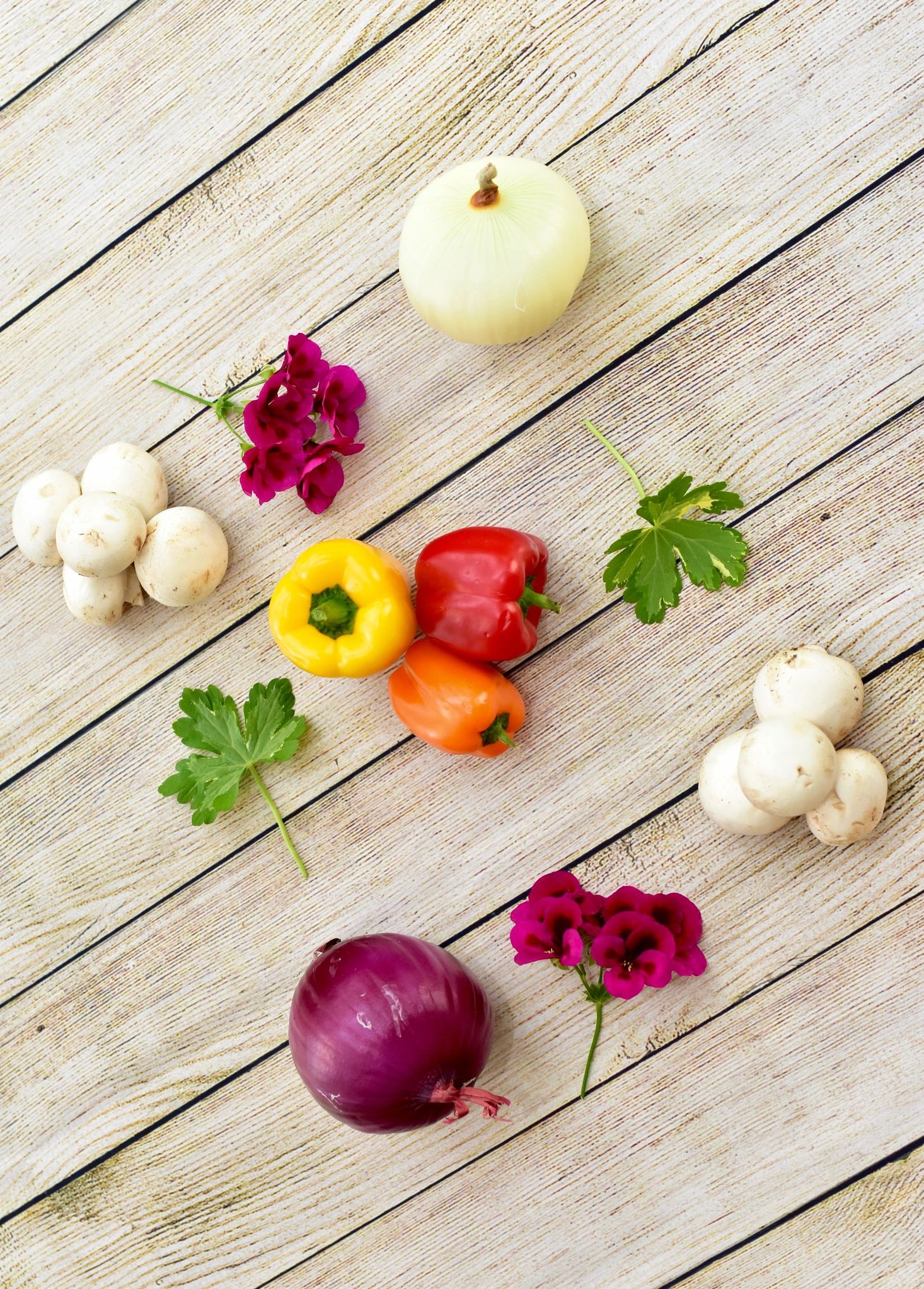 Summer harvest vegetables arranged in a simple pattern