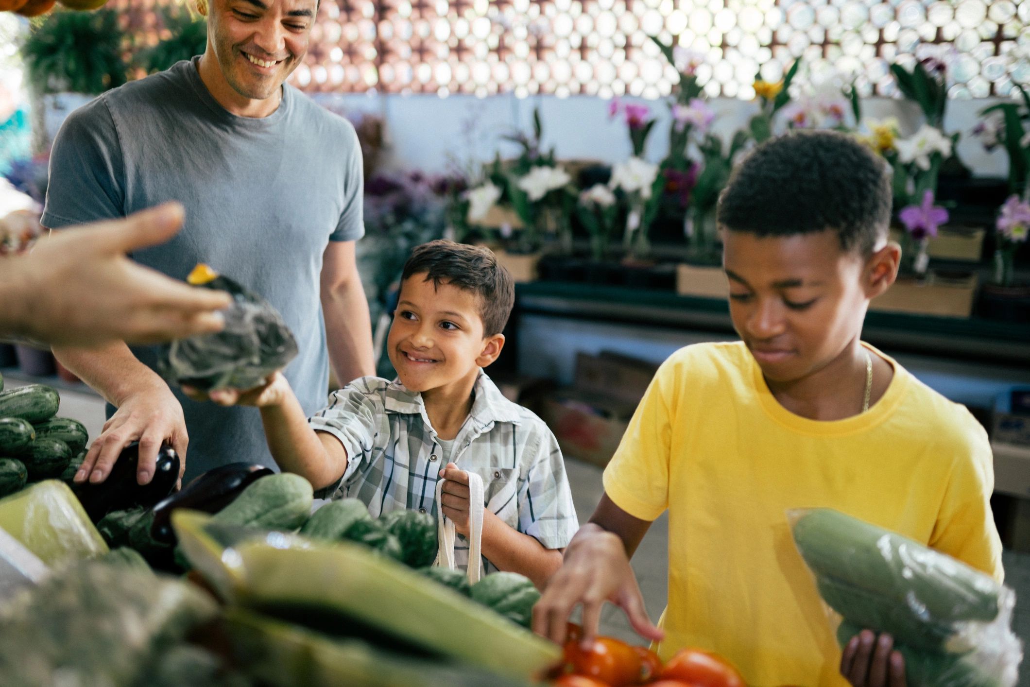 Customer selecting vegetables at a local market