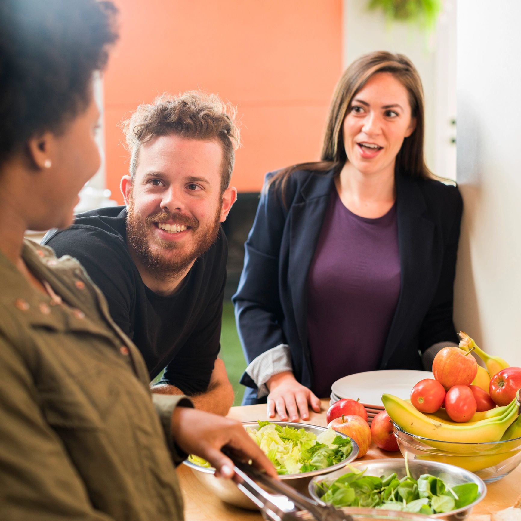 Friends preparing salad at home